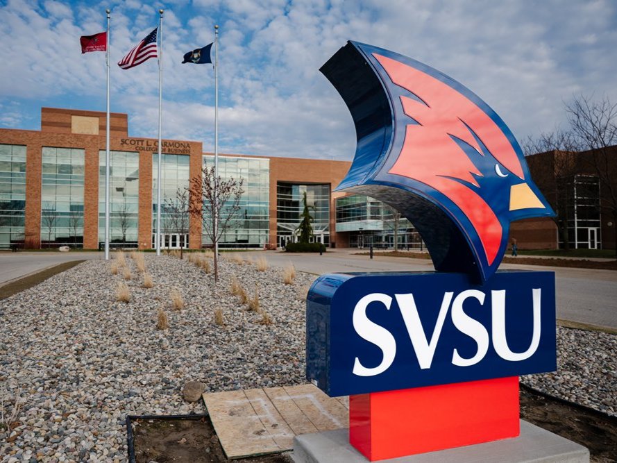 a sign in front of a building