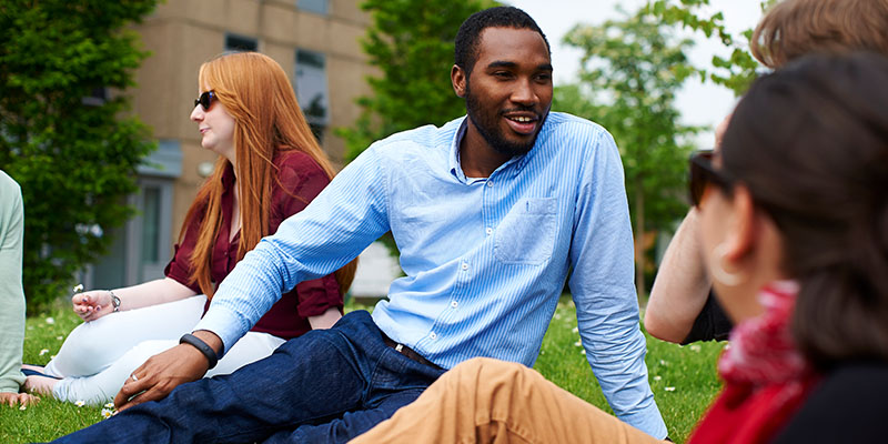 Postgraduates chatting on campus
