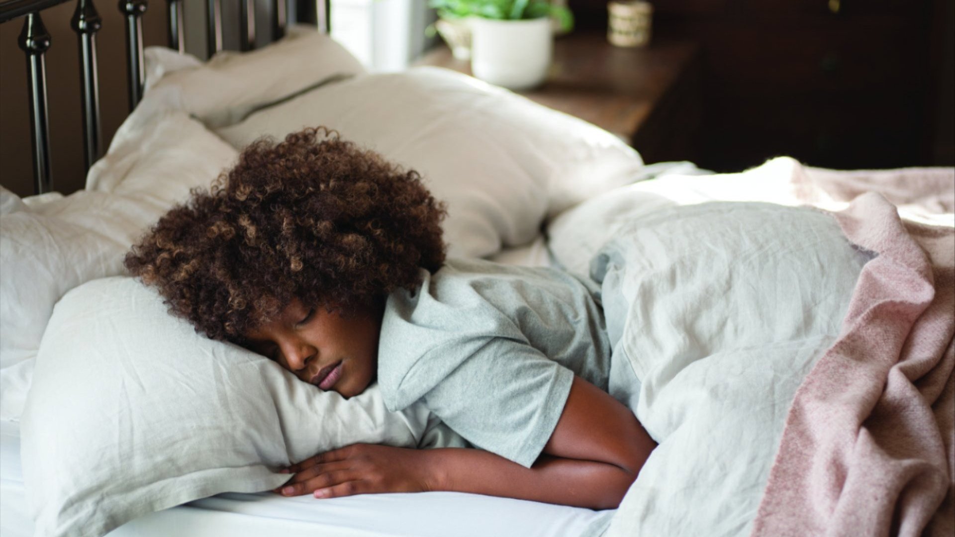 a woman sleeping in bed a woman sleeping in bed