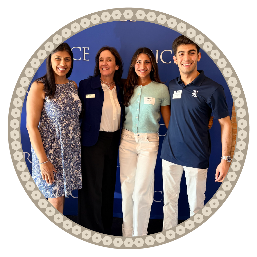 A group of four Rice University volunteers smiling