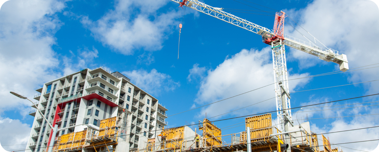 Photo of crane next to a building under construction in Waterloo Region