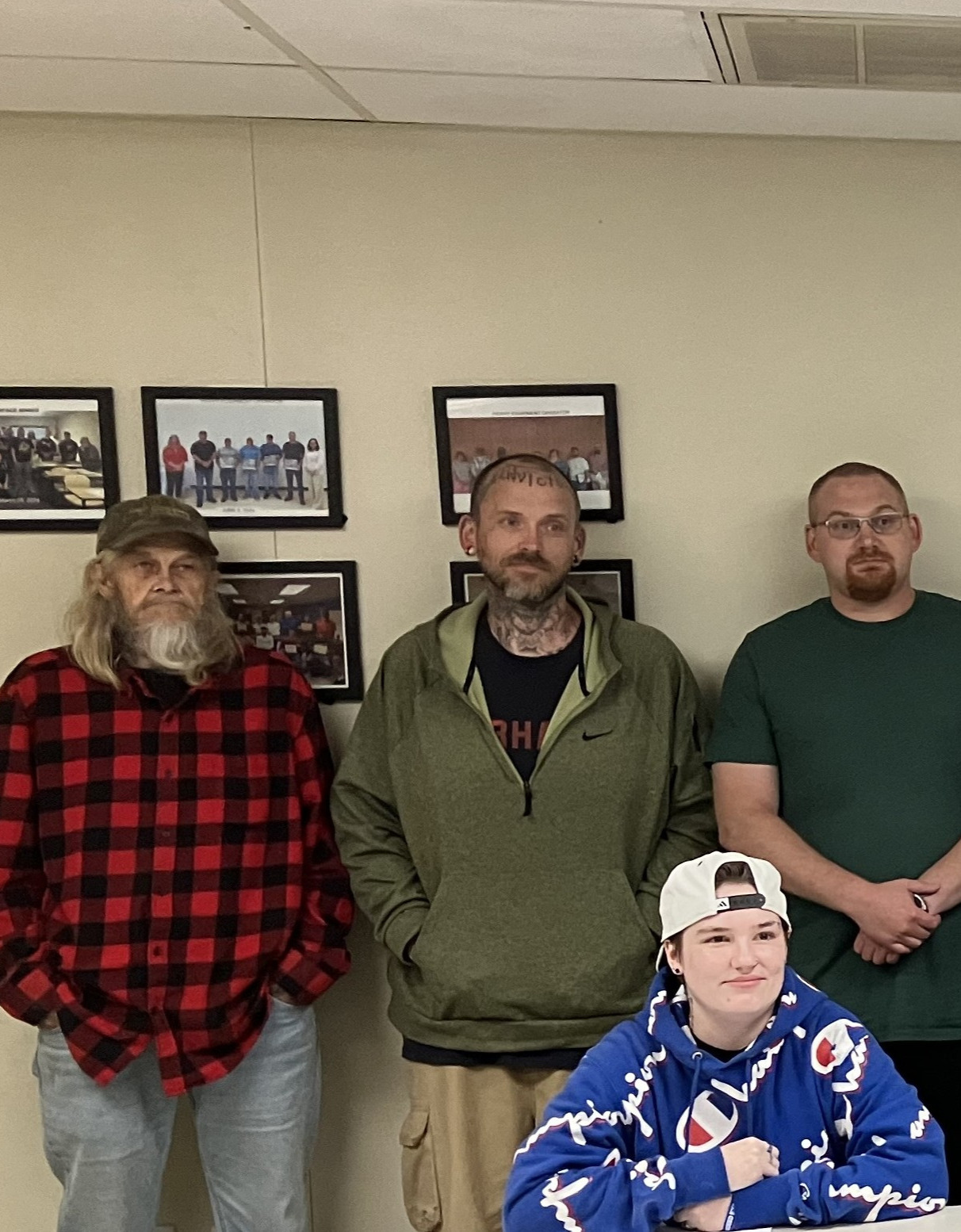 Detail of a larger group photograph shows four adults of various ages, members of the Southwest Regional Adult Education's spring 2026 surface mining class