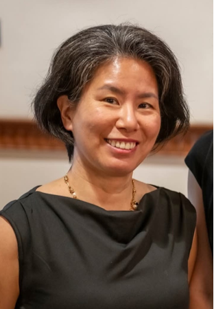 photograph of a stylish adult woman (PREP student EJ) facing camera and smiling