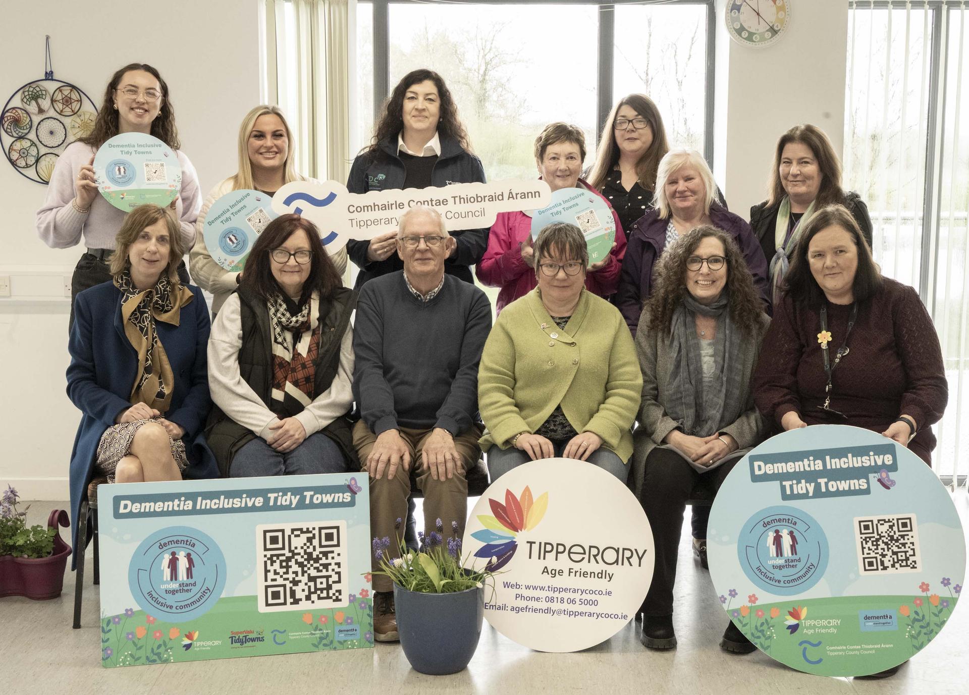 Group photo with Understand together posters