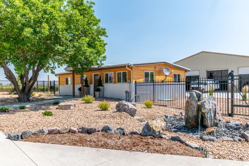 a woman and a boy sitting at a table with colored pencils a woman and a boy sitting at a table with colored pencils