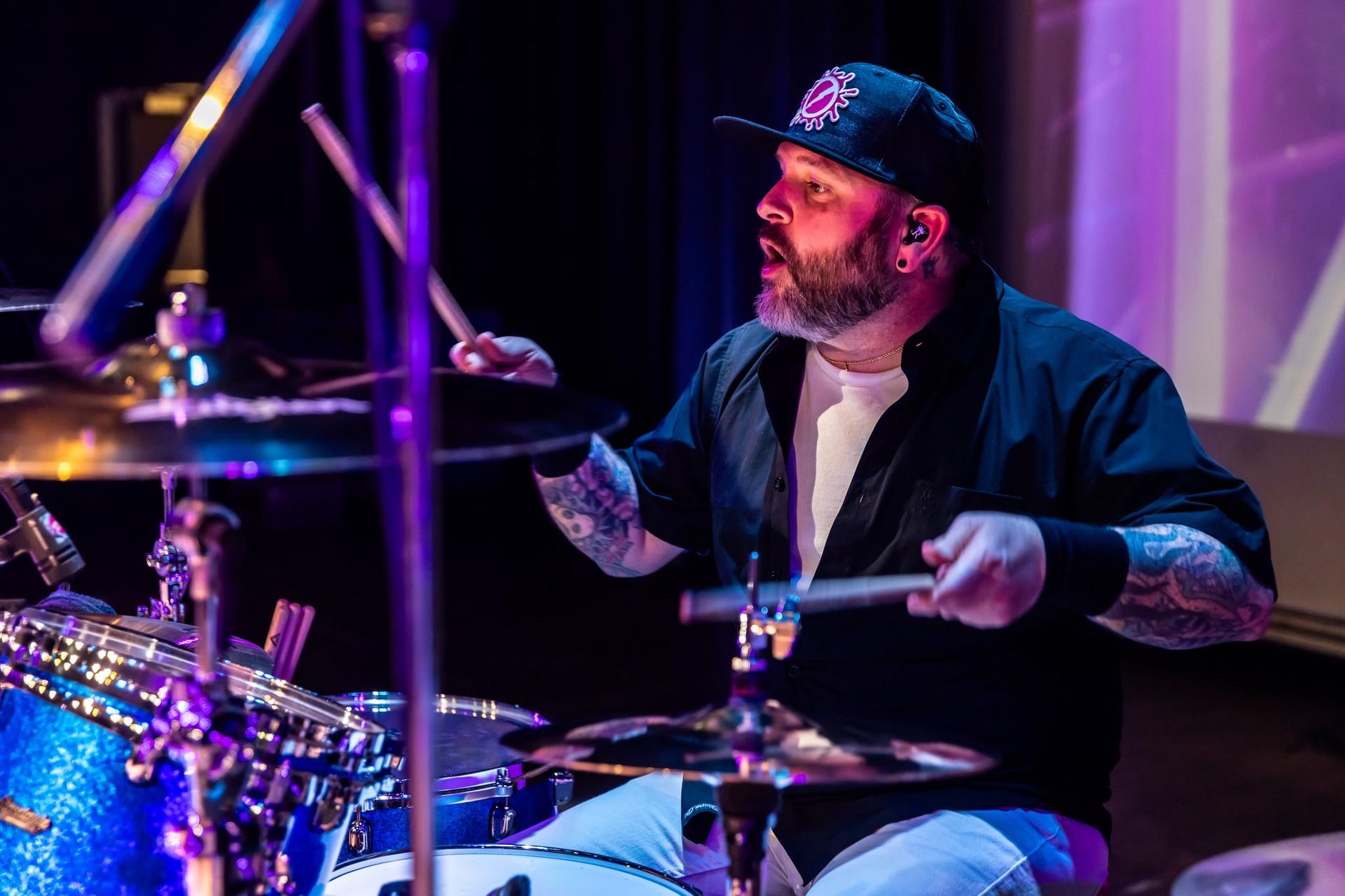 Heres to the night '90s band playing drums