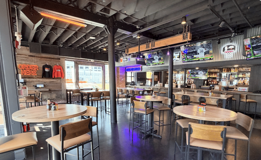 Genos steaks and bar building interior with tables