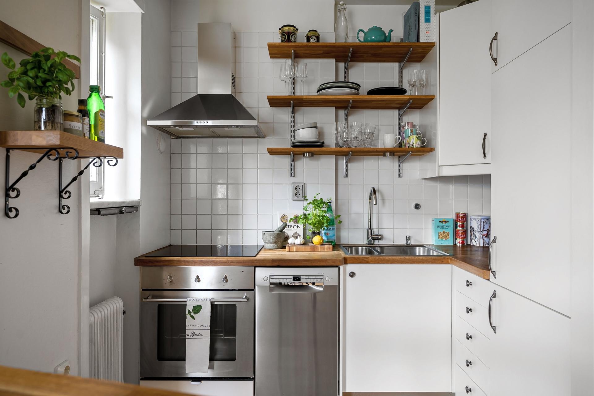 a kitchen with white cabinets and white cabinets