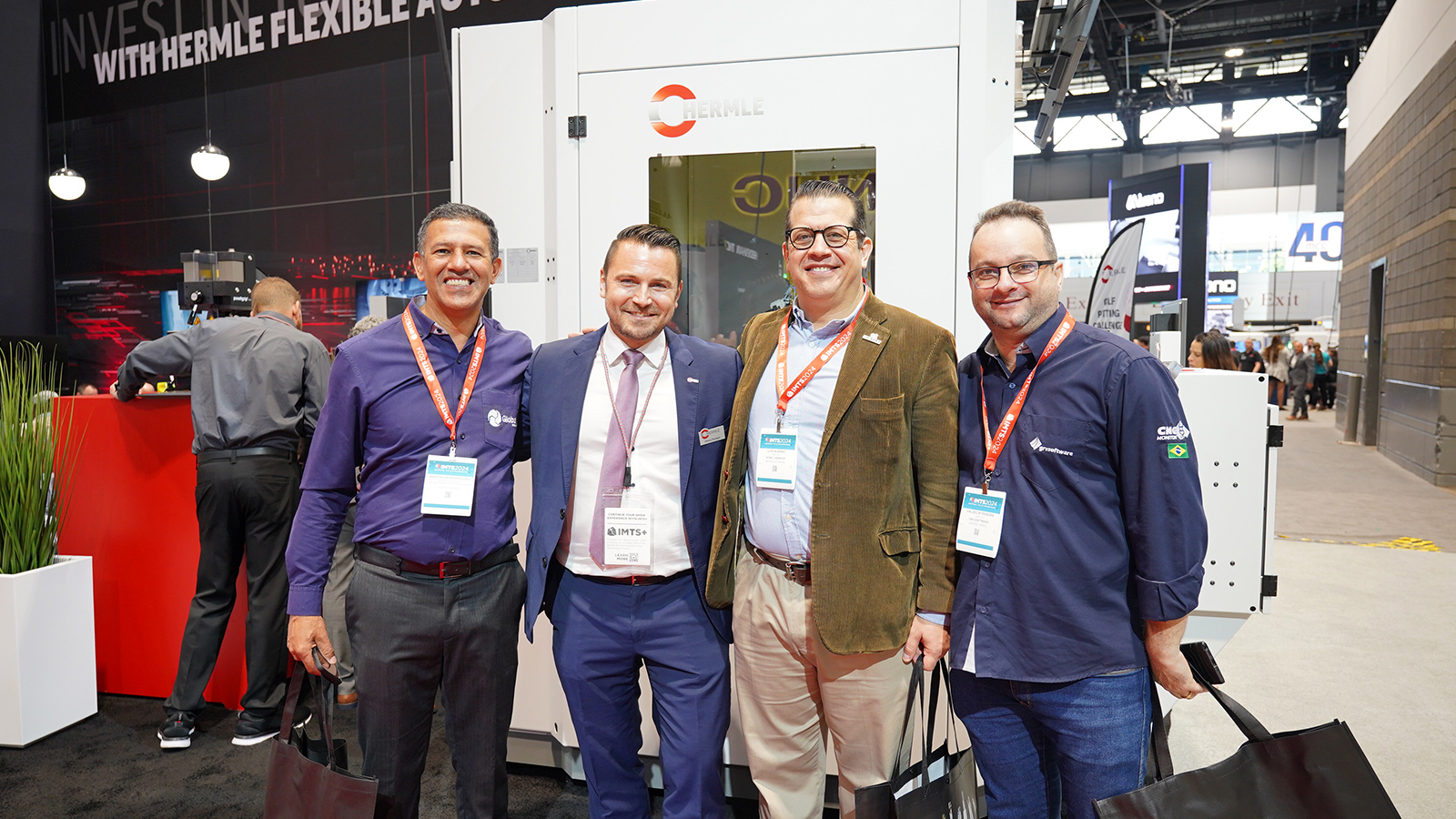 HERMLE team with visitors at booth