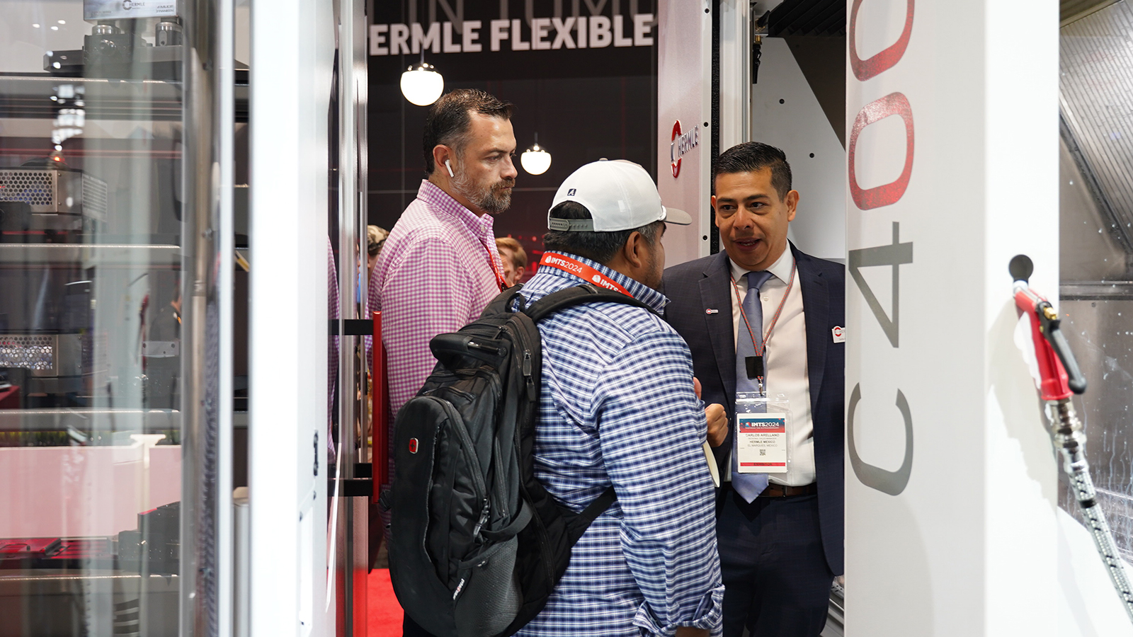 Visitors touring HERMLE C400 machine