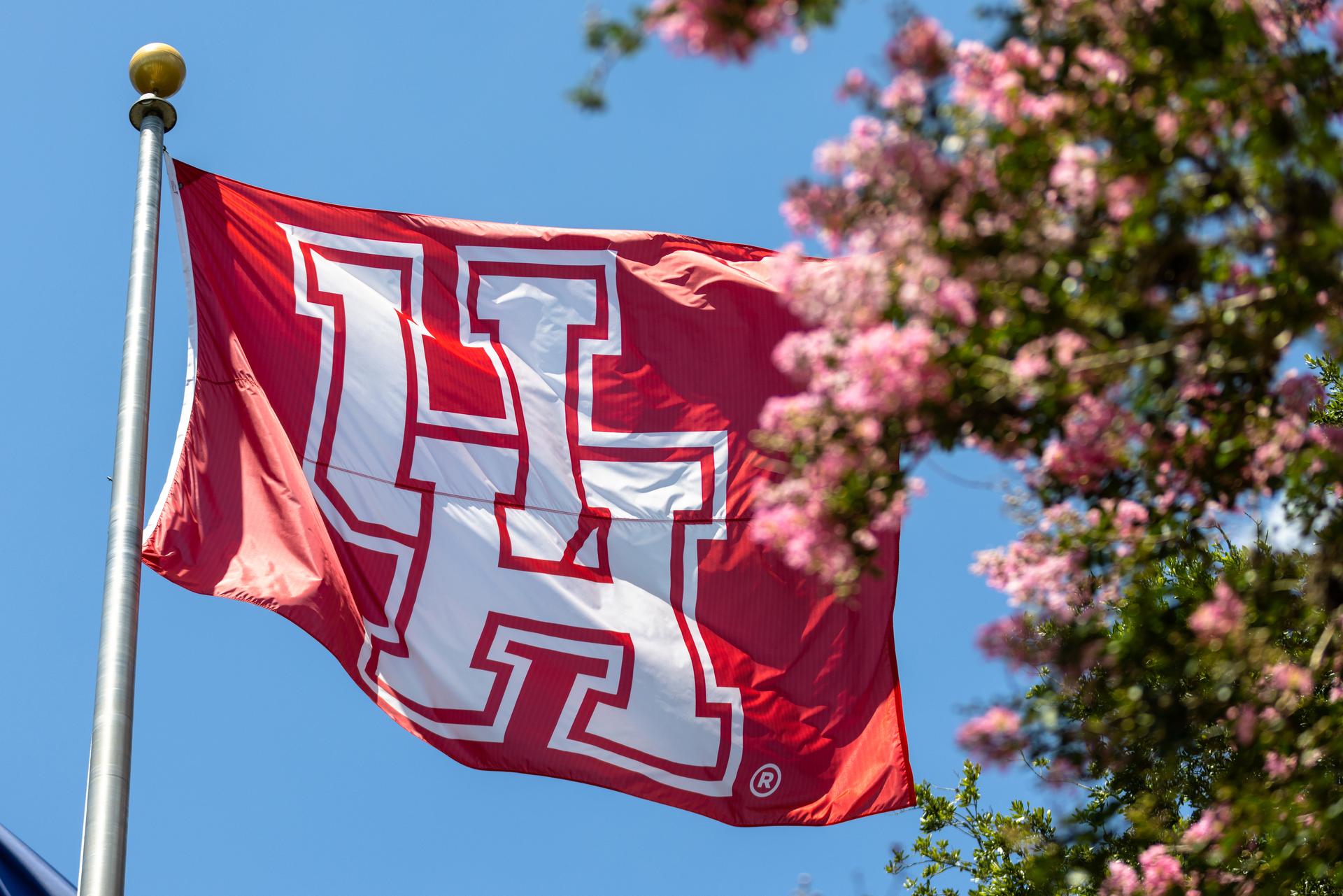 Photo of red flag with white UH logo