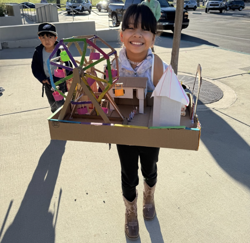 Student holds carnival model