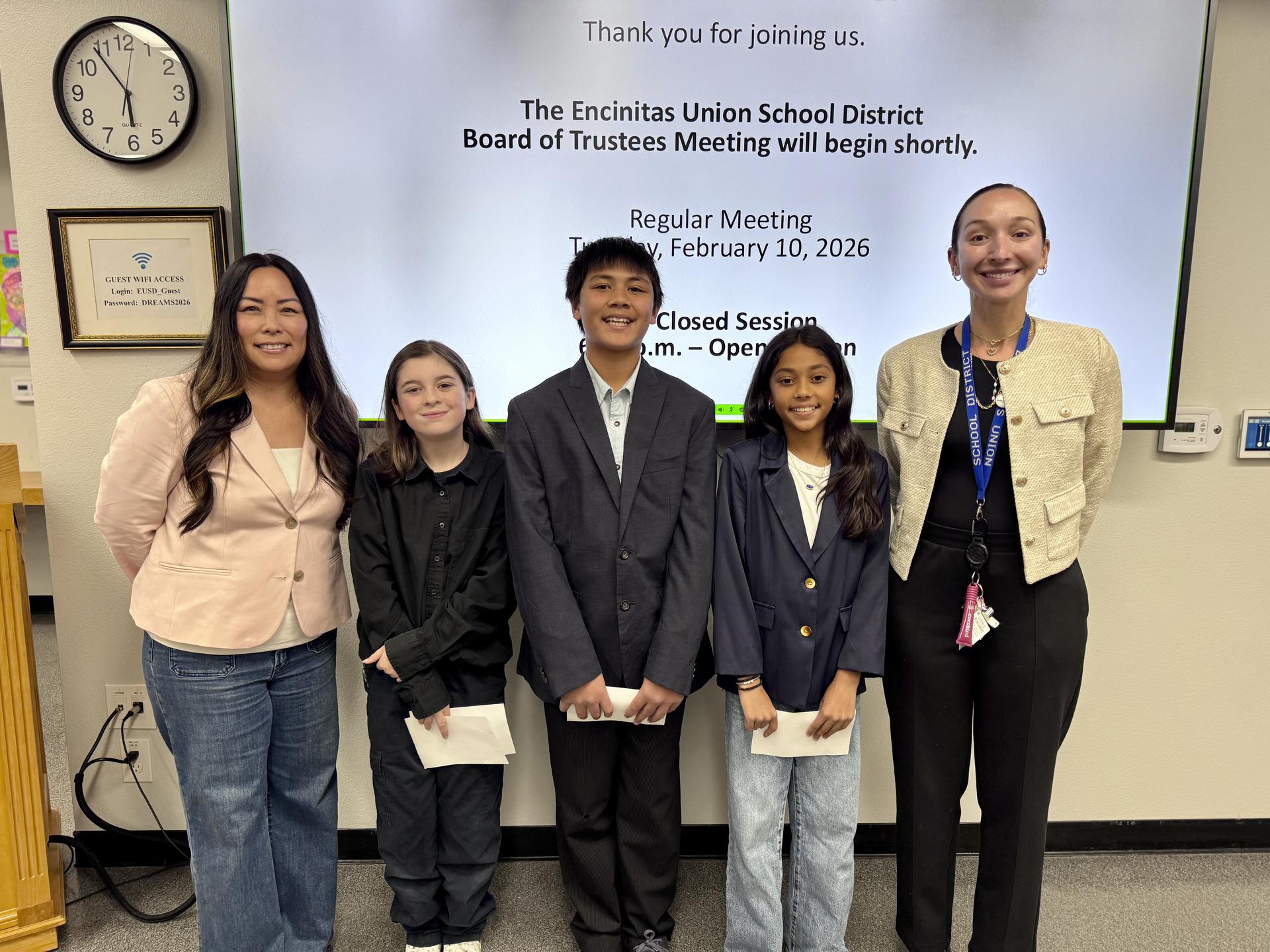 Flora Vista students stand with Principal Oyagi and MTSS TOSA Elizabeth Erbes for a photo.