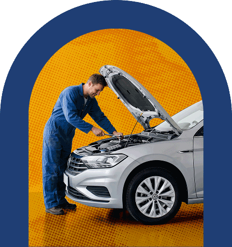 A technician servicing a vehicle