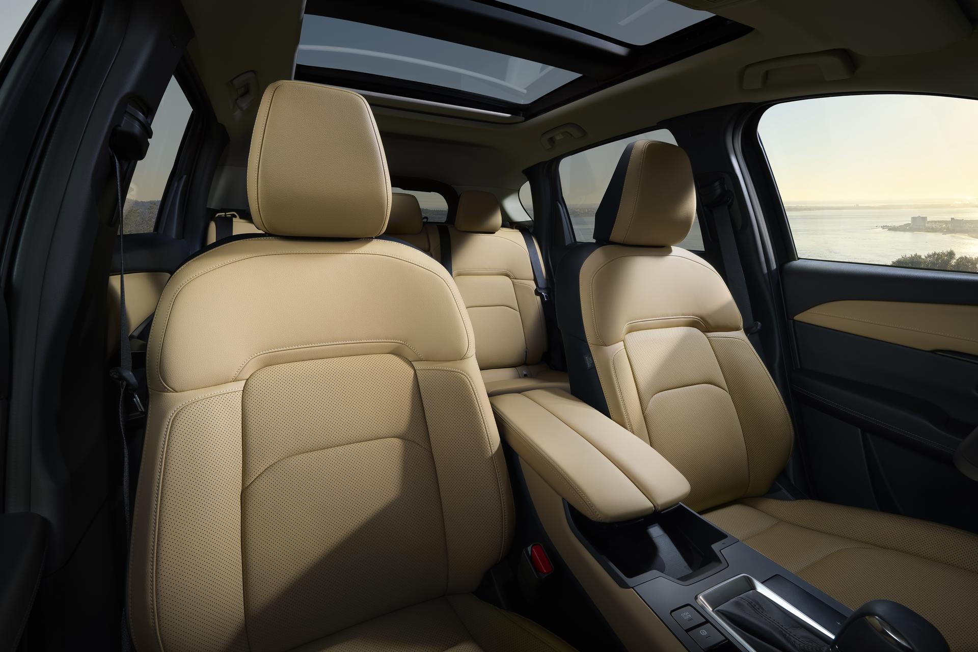 Premium CX-5 interior featuring tan leather seats, panoramic moonroof, and a spacious, refined cabin design. Premium CX-5 interior featuring tan leather seats, panoramic moonroof, and a spacious, refined cabin design.