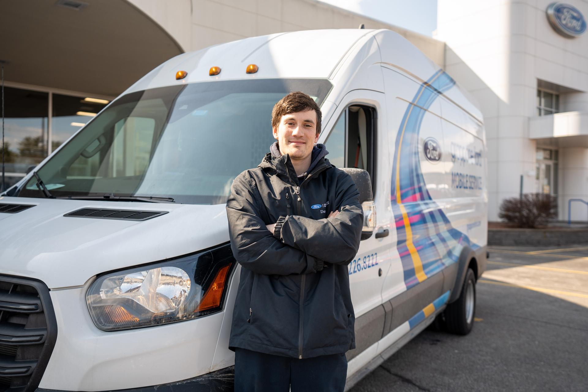 Tech in front of Mobile Service van Tech in front of Mobile Service van