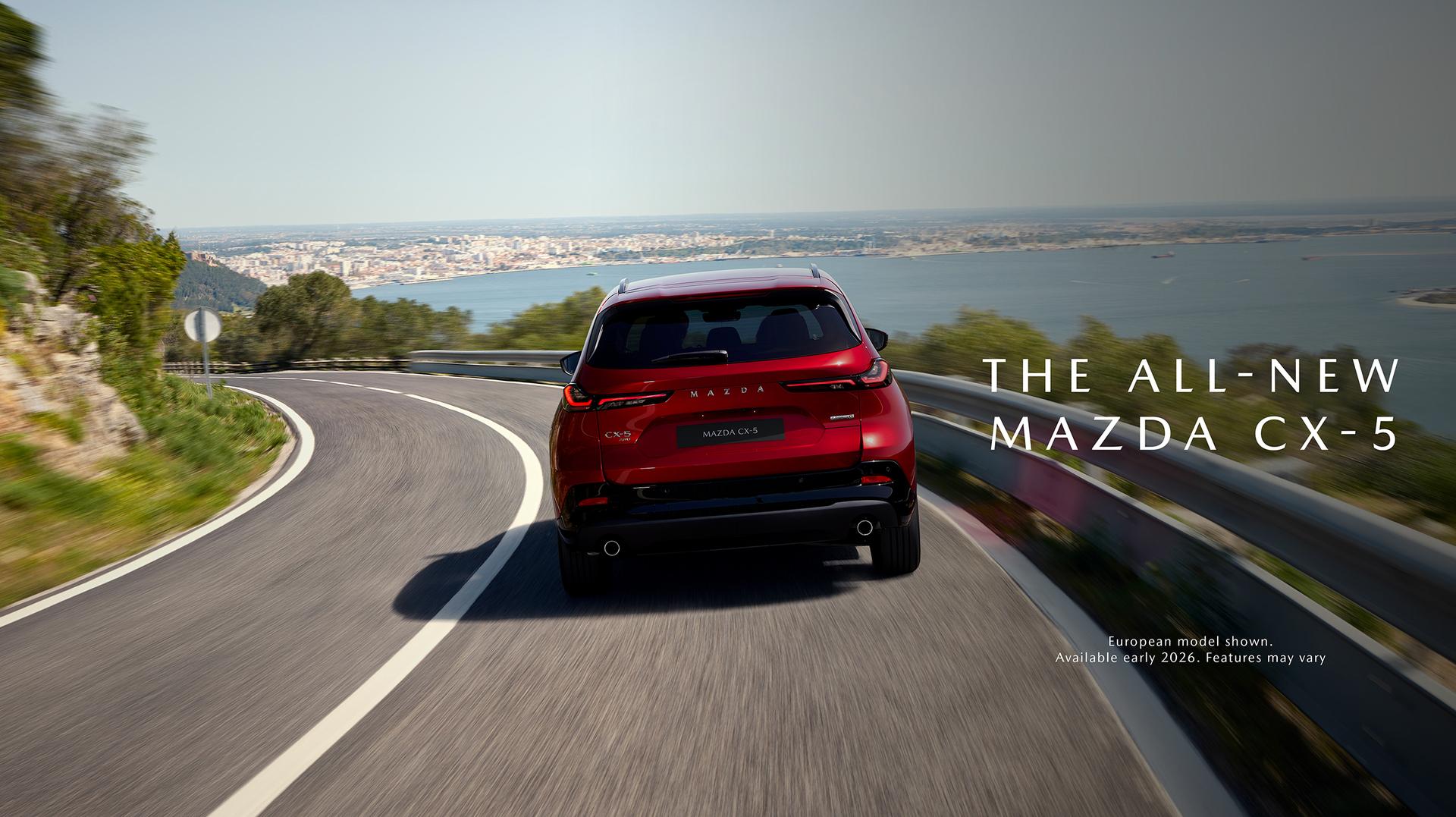 Wide banner image of a red Mazda CX-5 driving on a winding coastal highway with text: “The All-New Mazda CX-5. European model shown. Available early 2026. Features may vary.” Wide banner image of a red Mazda CX-5 driving on a winding coastal highway with text: “The All-New Mazda CX-5. European model shown. Available early 2026. Features may vary.”
