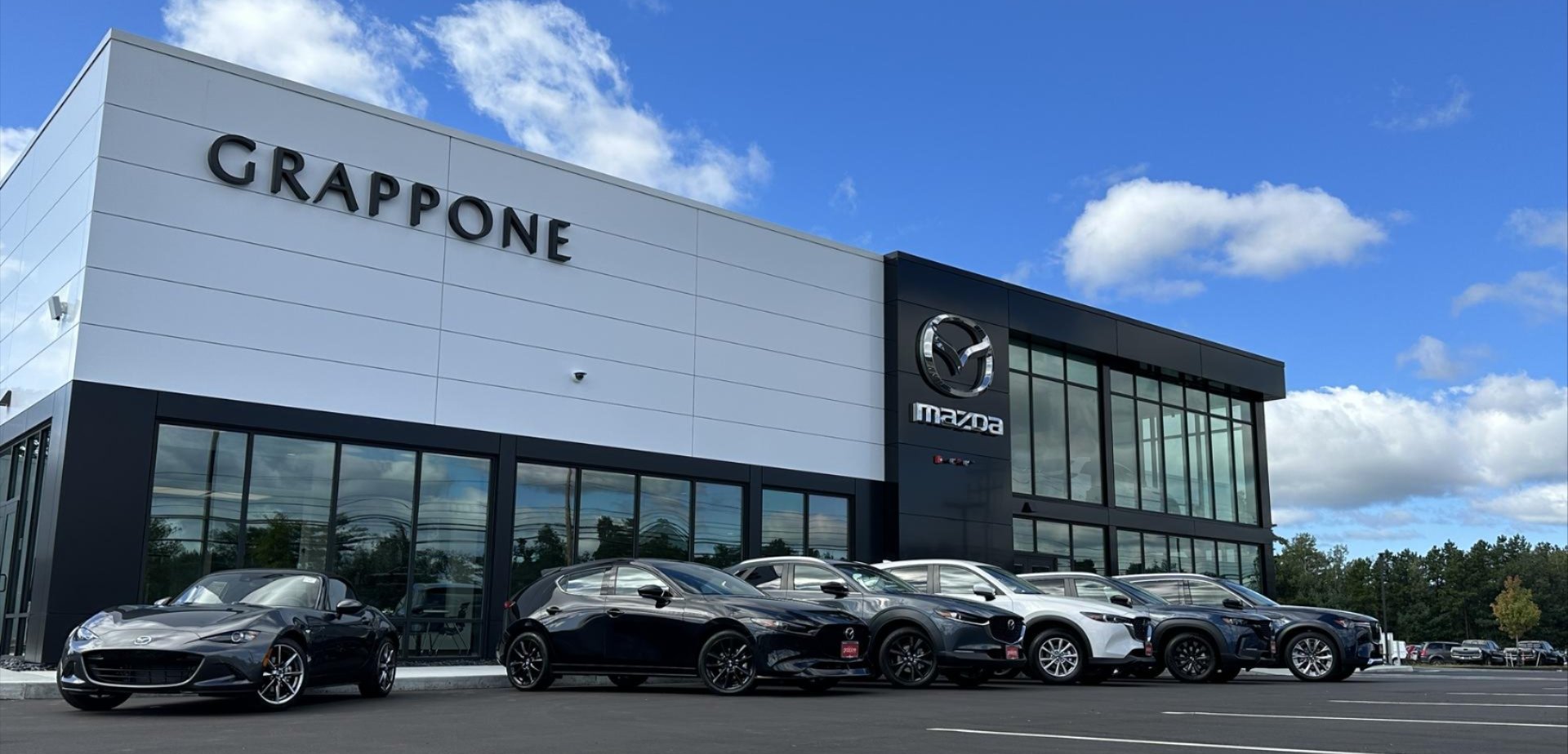 Grappone Mazda front of building with Mazda vehicles