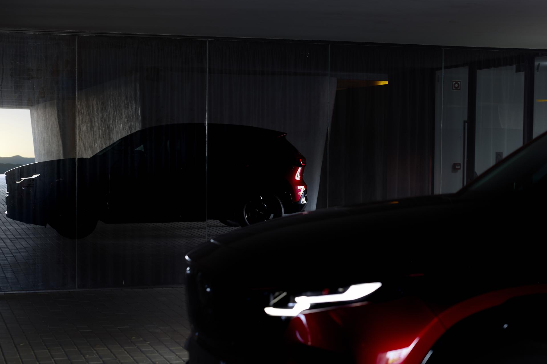 Red Mazda CX-5 viewed from the front and rear in a low-lit modern structure, emphasizing its bold styling and illuminated lighting elements. Red Mazda CX-5 viewed from the front and rear in a low-lit modern structure, emphasizing its bold styling and illuminated lighting elements.
