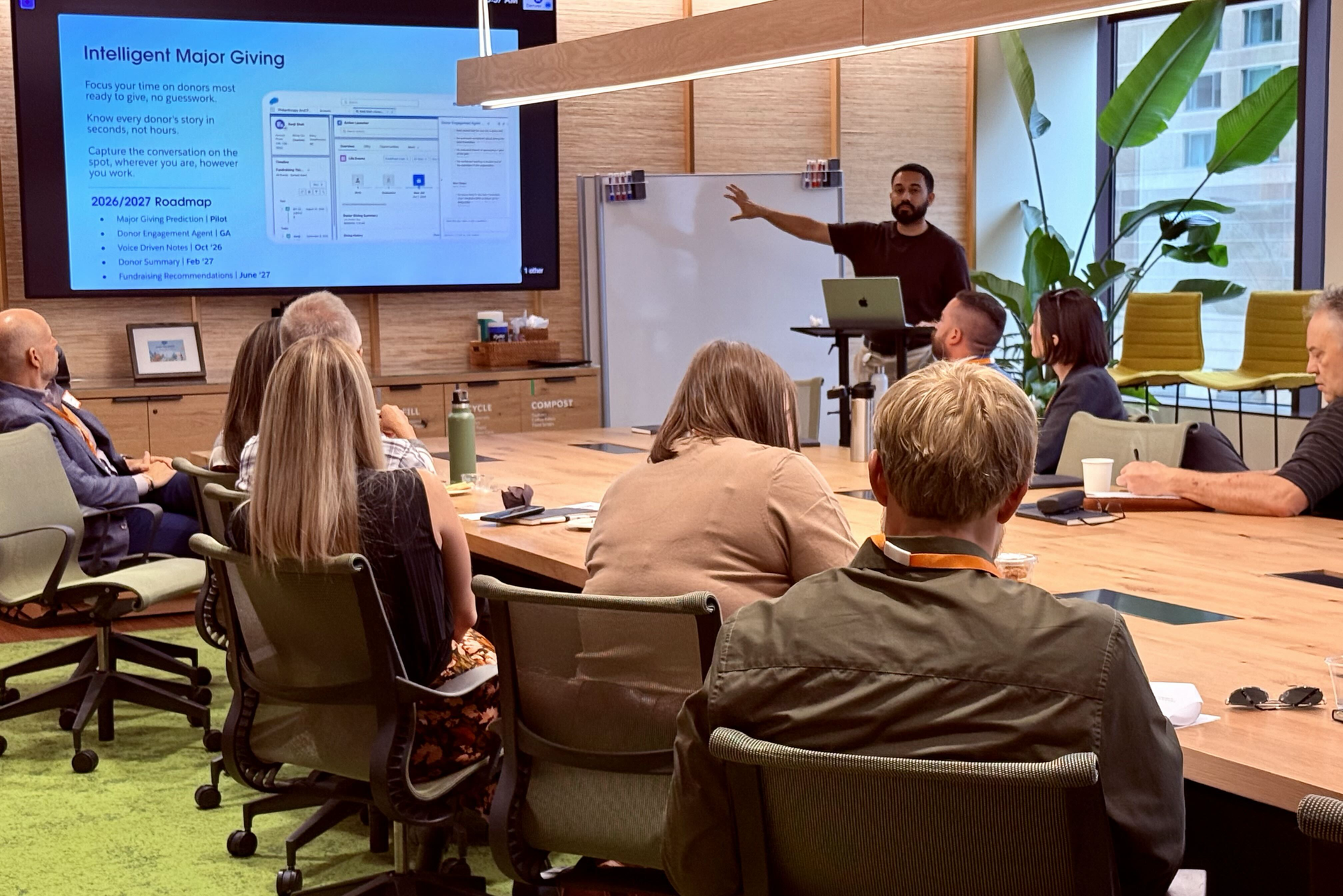 Group of people at a table for an Arkus and Salesforce technology event in Denver