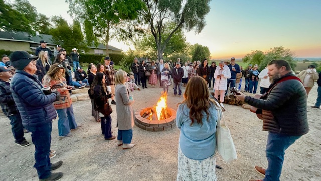 Sunrise worship service by campfire