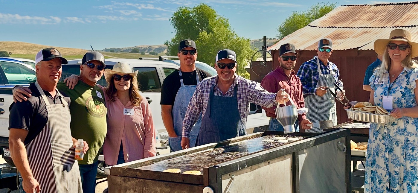 Volunteers cooking pancakes