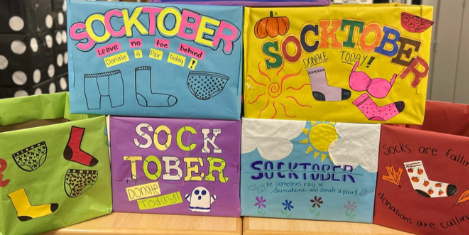Six donation boxes displaying bright colors, words like 
