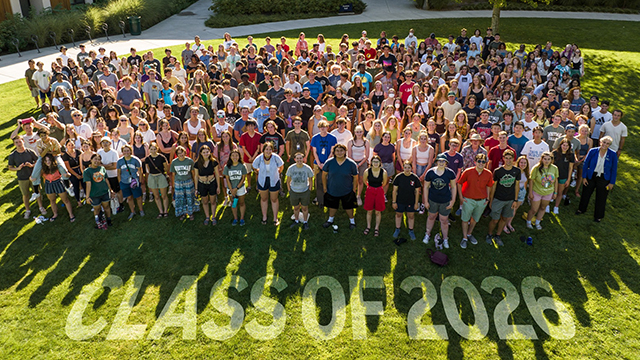 A very large group of students pose for a group photo with “Class of 2026” superimposed on the image.