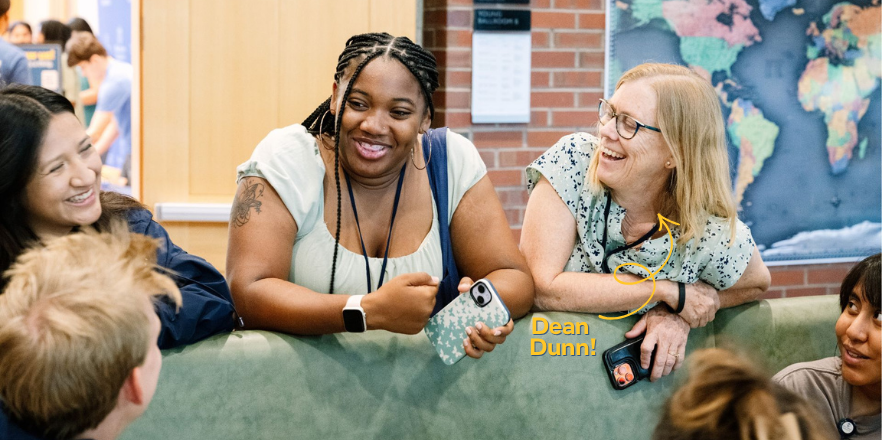 Dean Juli Dunn laughing with a group of students in Reid Campus Center