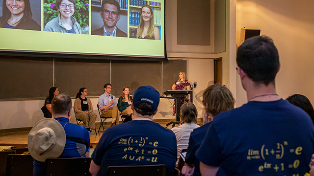 A panel of Whitman alumni on stage in Olin Auditorium