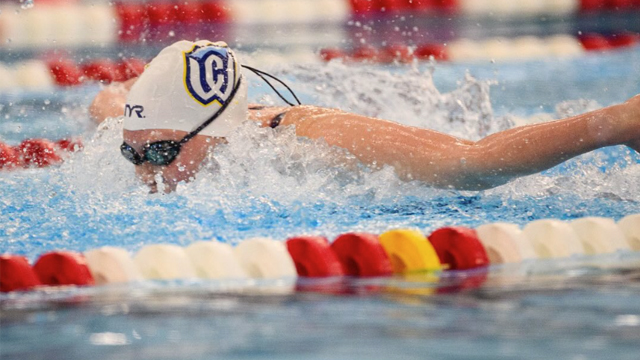 Avery Riley swimming in a lane at the 2026 Northwest Conference Championships