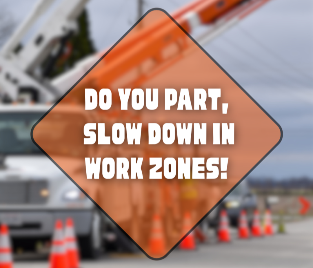 a construction site with a crane and orange cones