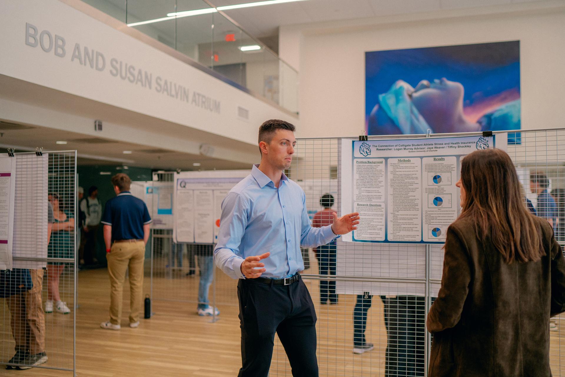 A presentation at a capstone event where student's display research they've been working on.