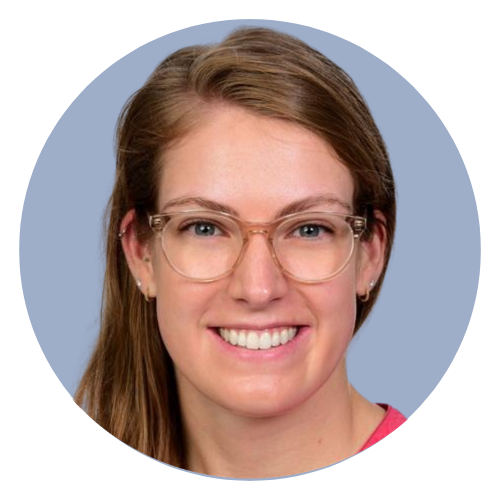 a woman wearing glasses and smiling