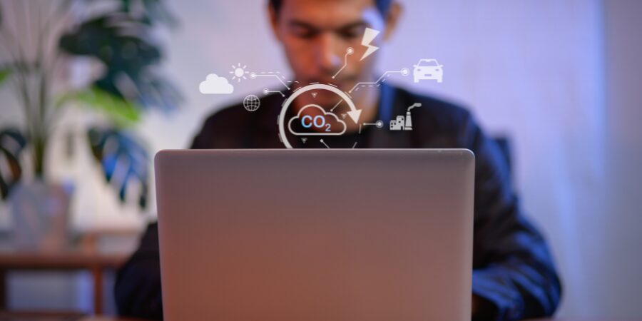 a man looking at a laptop