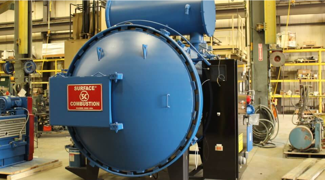 a large blue machine in a factory