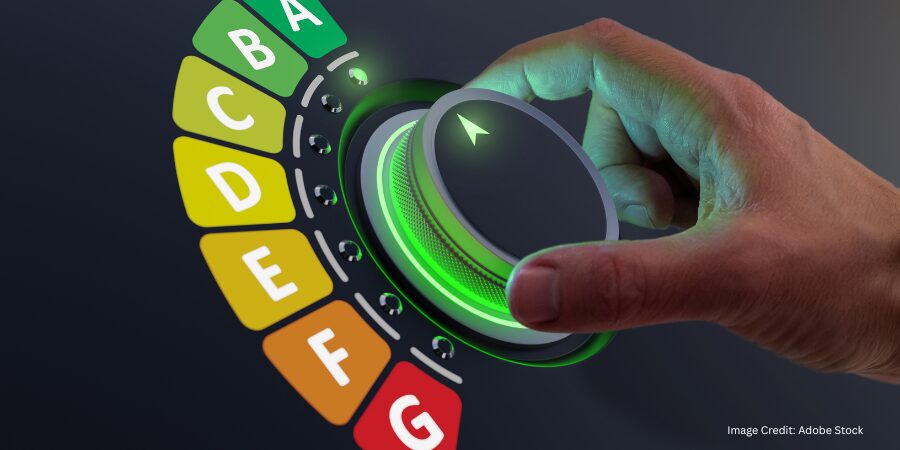 a hand turning a light on a dial
