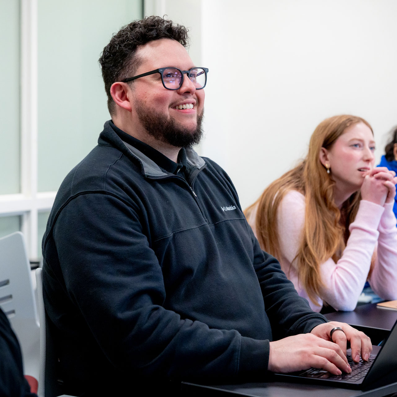 Andrés Castro Samayoa in class with a student