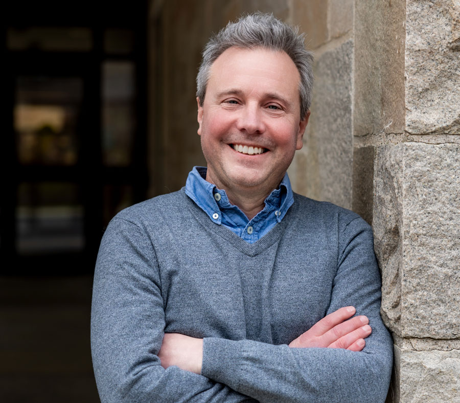 Eric Dearing leans against a wall