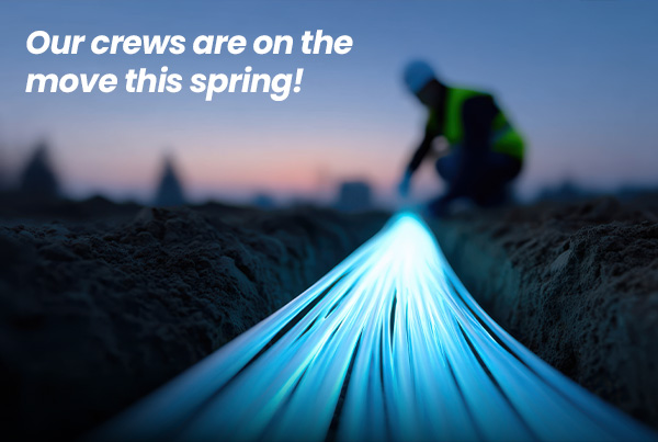 Our crews are on the move this spring! Image: Lineworker laying fiber lines.