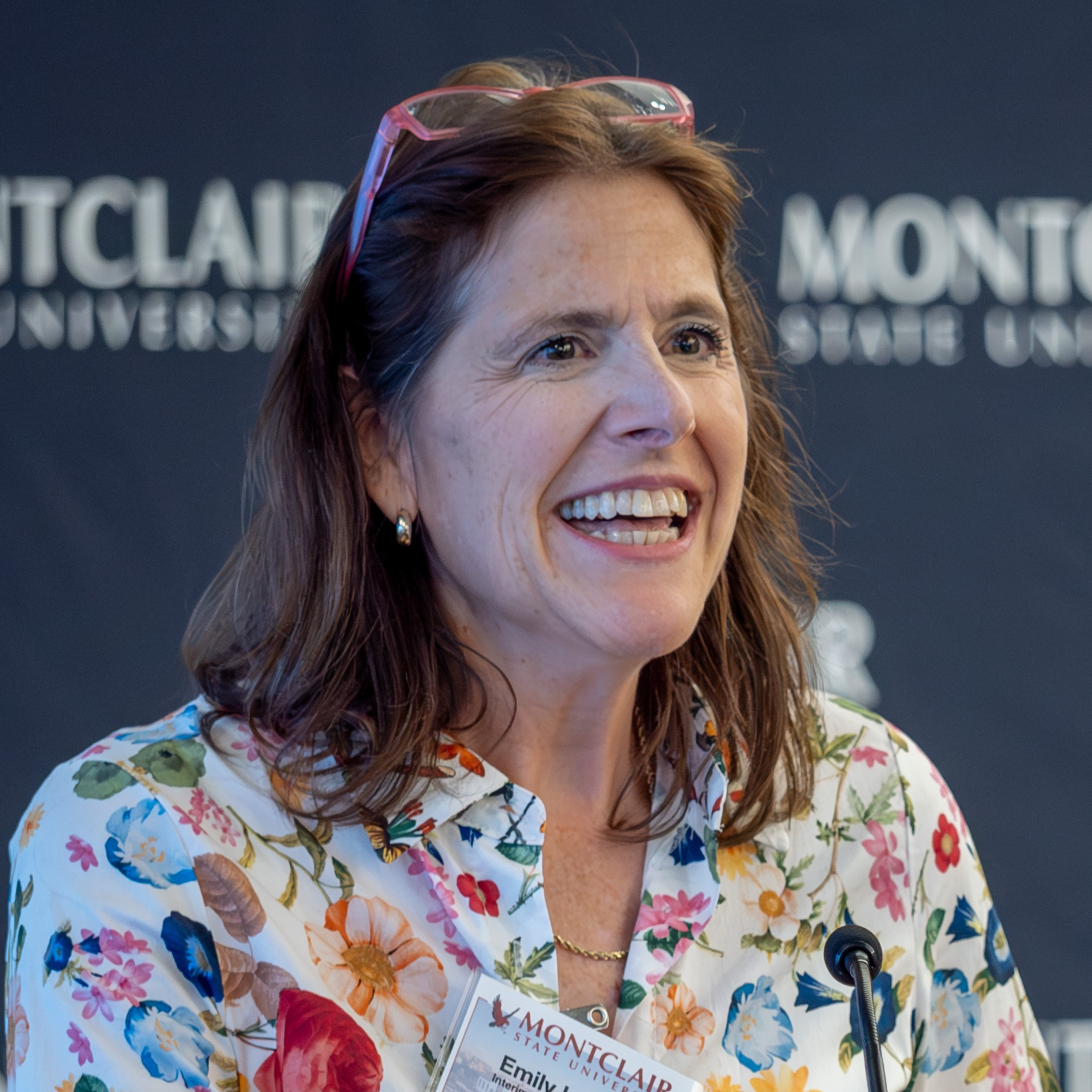 Senior Associate Provost Emily Isaacs speaks at a podium.