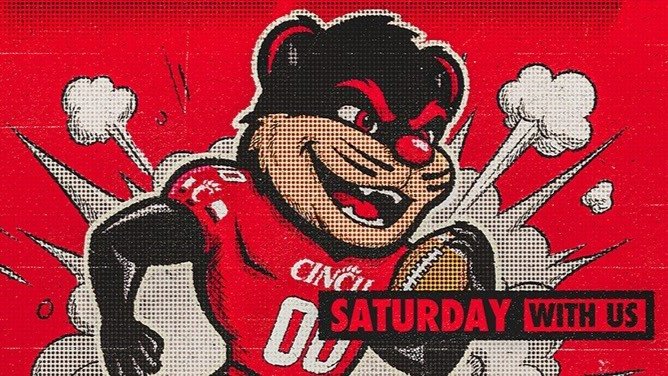 Cincinnati Bearcats mascot holding a football.