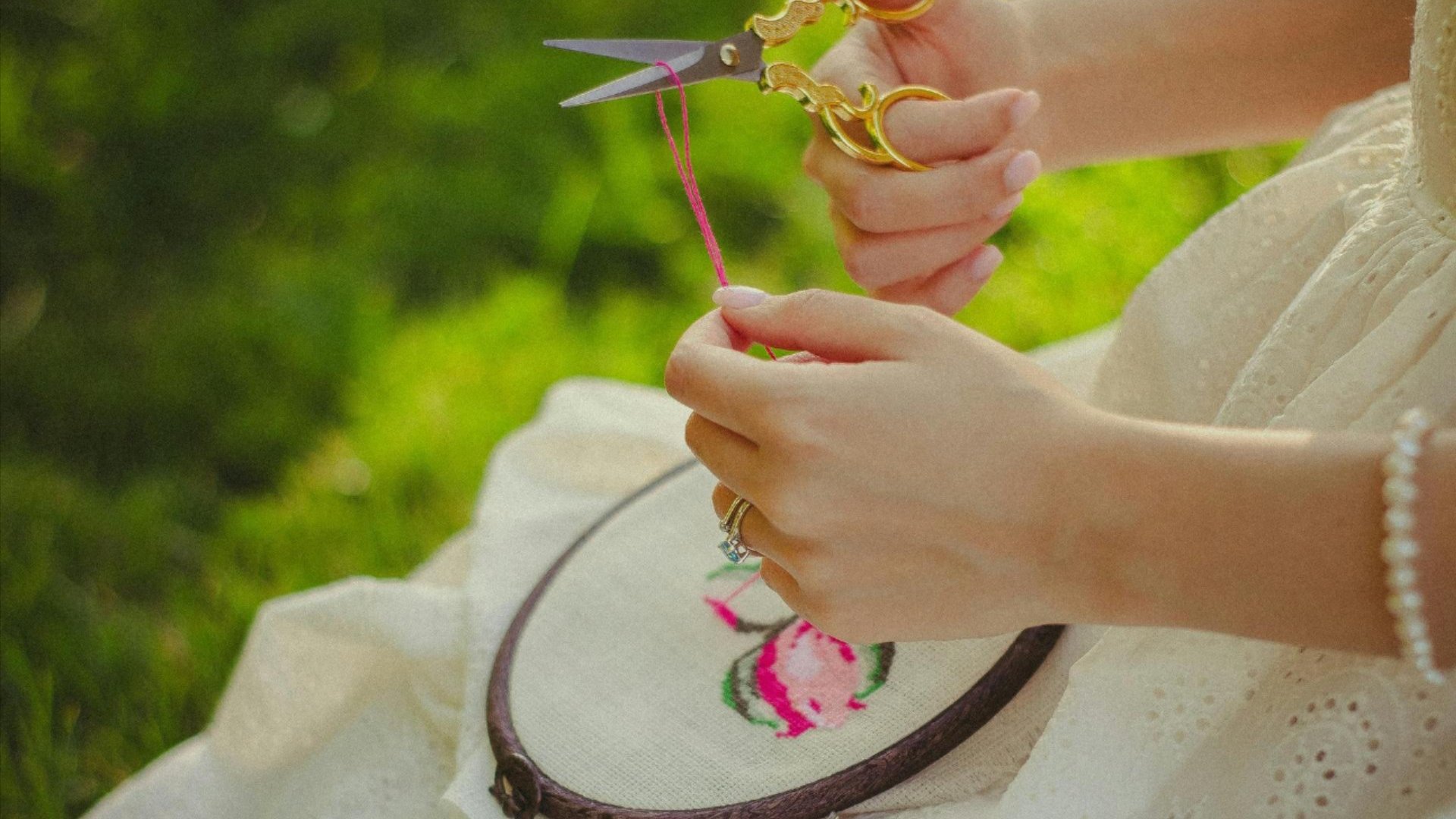 A person needlepointing