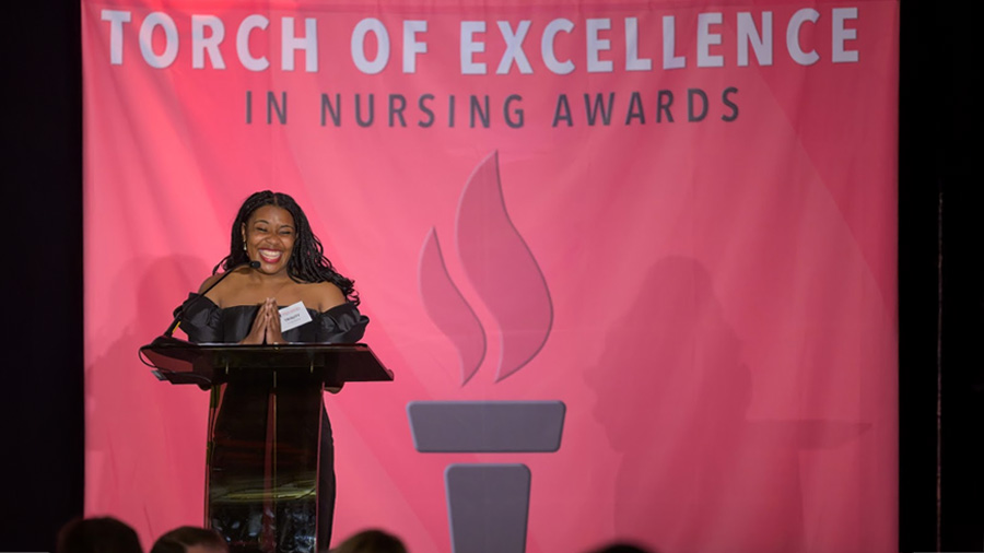 Woman speaking at the Torch of Excellence in Nursing Awards