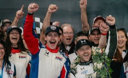 UC graduate JP Suozzi celebrates with Indianapolis 500 winner Felix Rosenqvist at Indianapolis Motor Speedway 