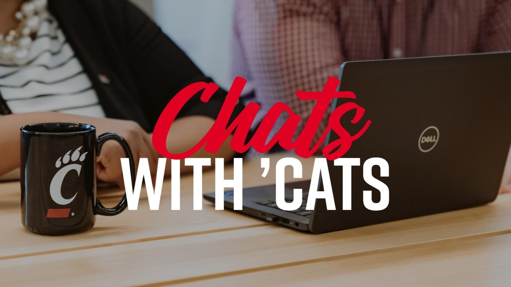 C-paw coffee mug and laptop in the background with 'Chats with 'Cats' written overtop of the image