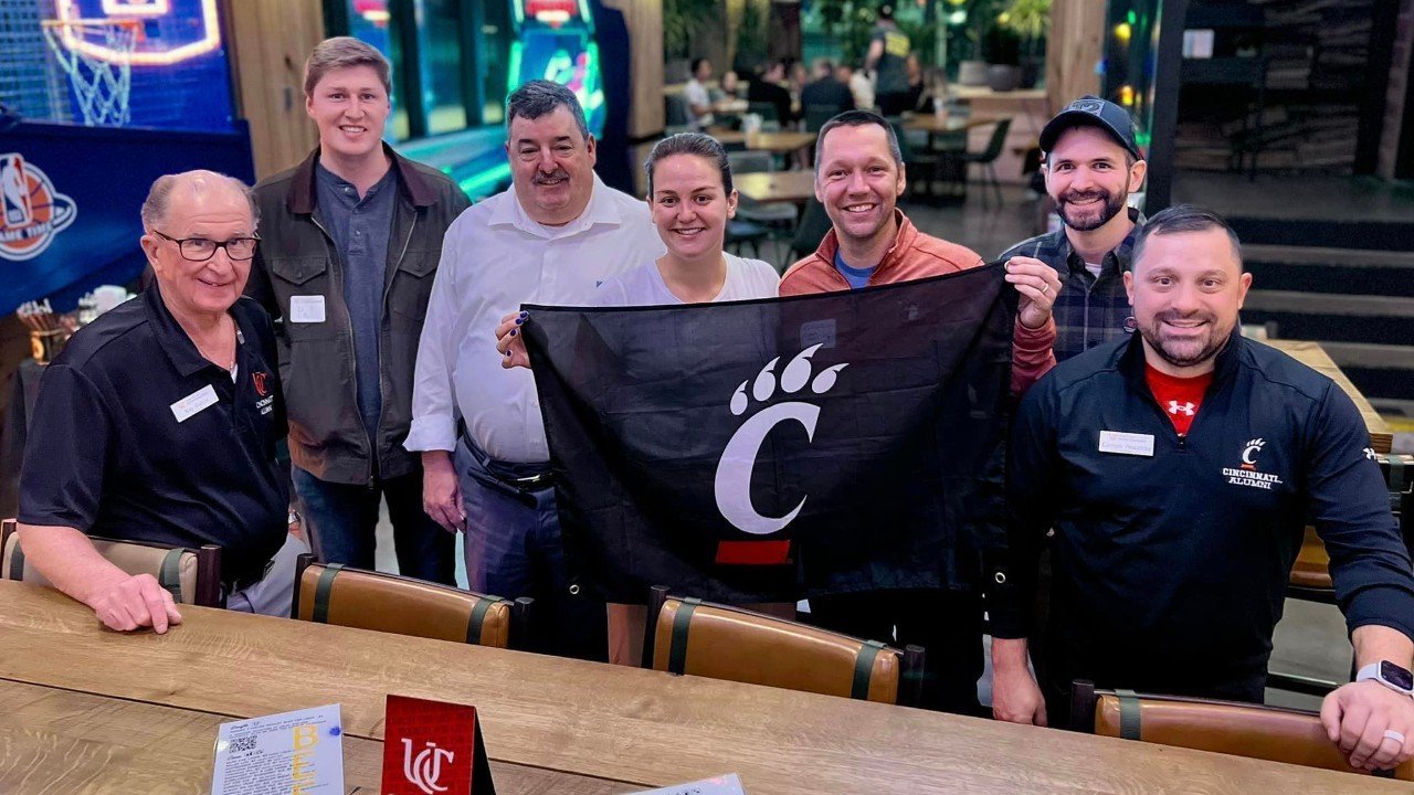 Local UC alumni and fans at a game watch