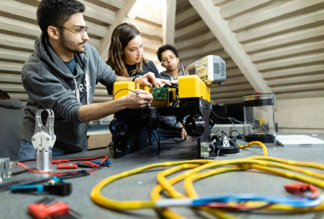 Students in a lab working with equipment