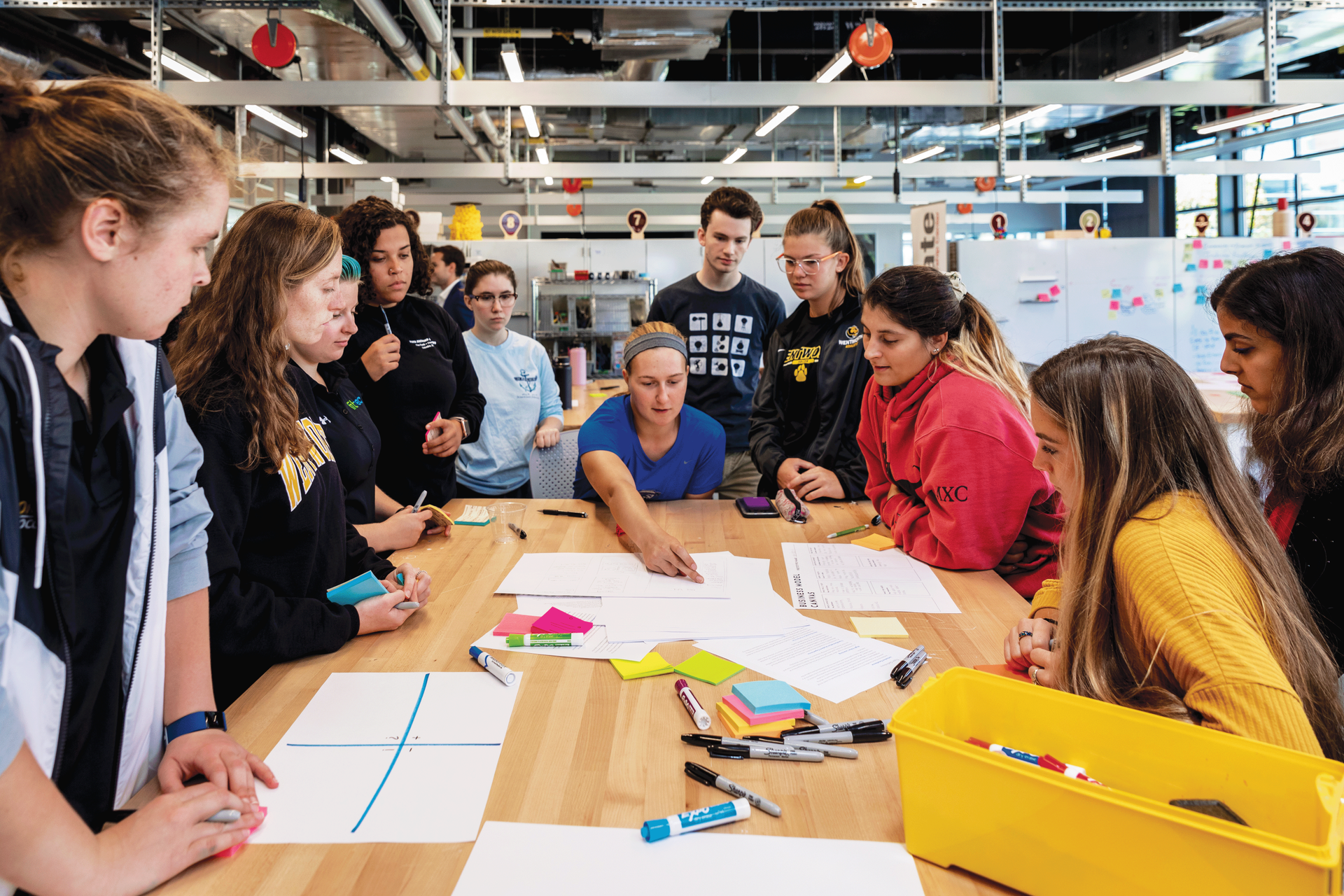 Large group of students gathered at a table