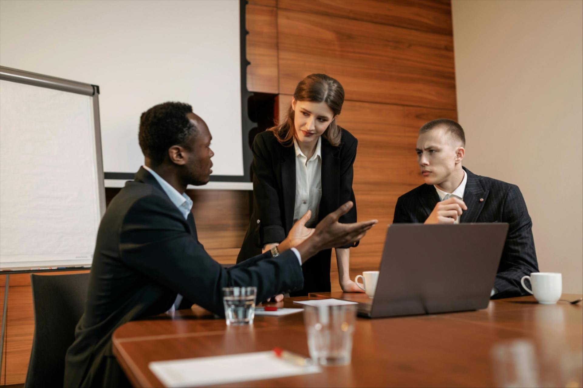 A group of people sitting around a meeting table.